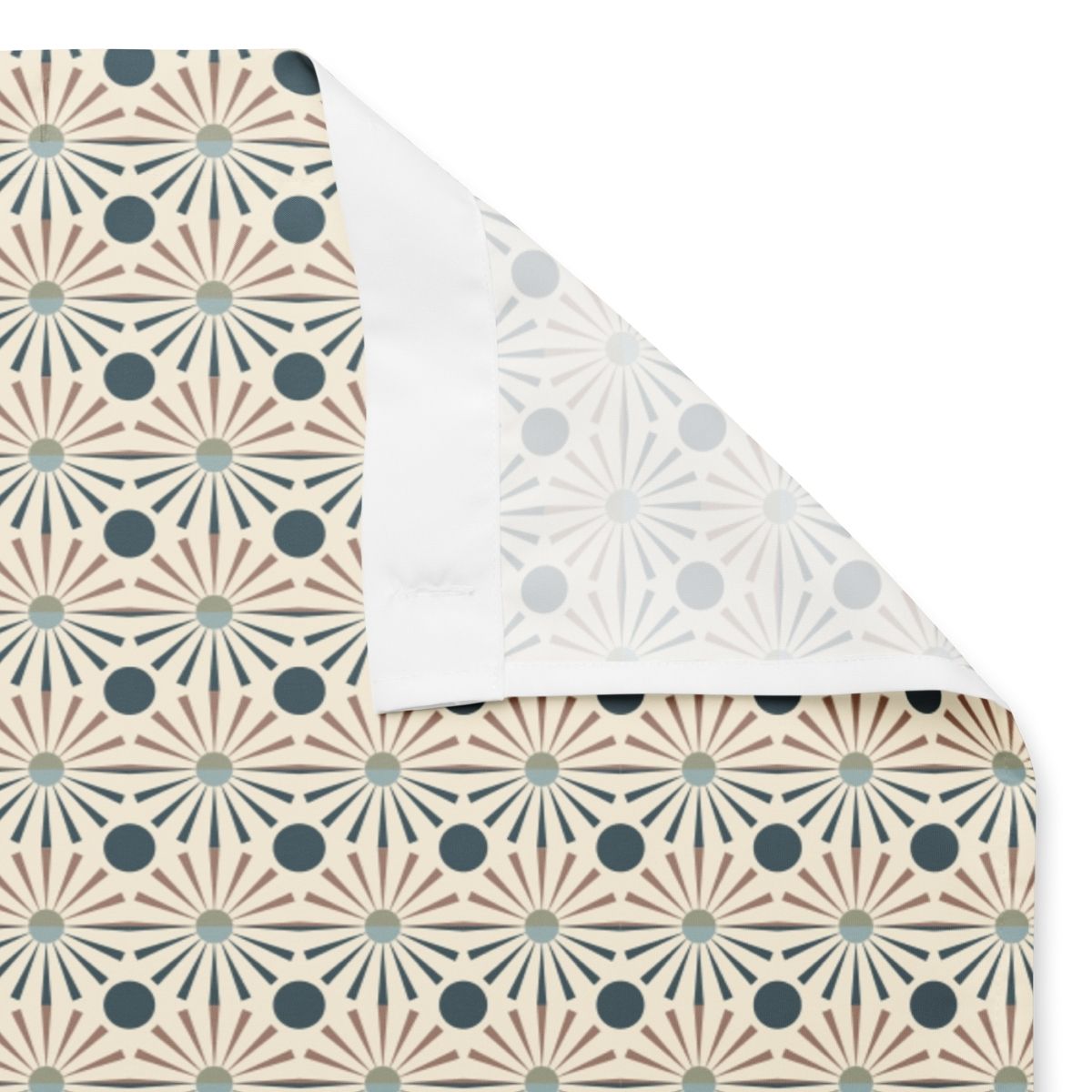 A view of the Aaron shower curtain simultaneously showing the front, back, and sewn eyelets for rings.