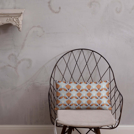 The cozy Betty lumbar pillow in a metal chair to showcase the beautiful colors of the design.