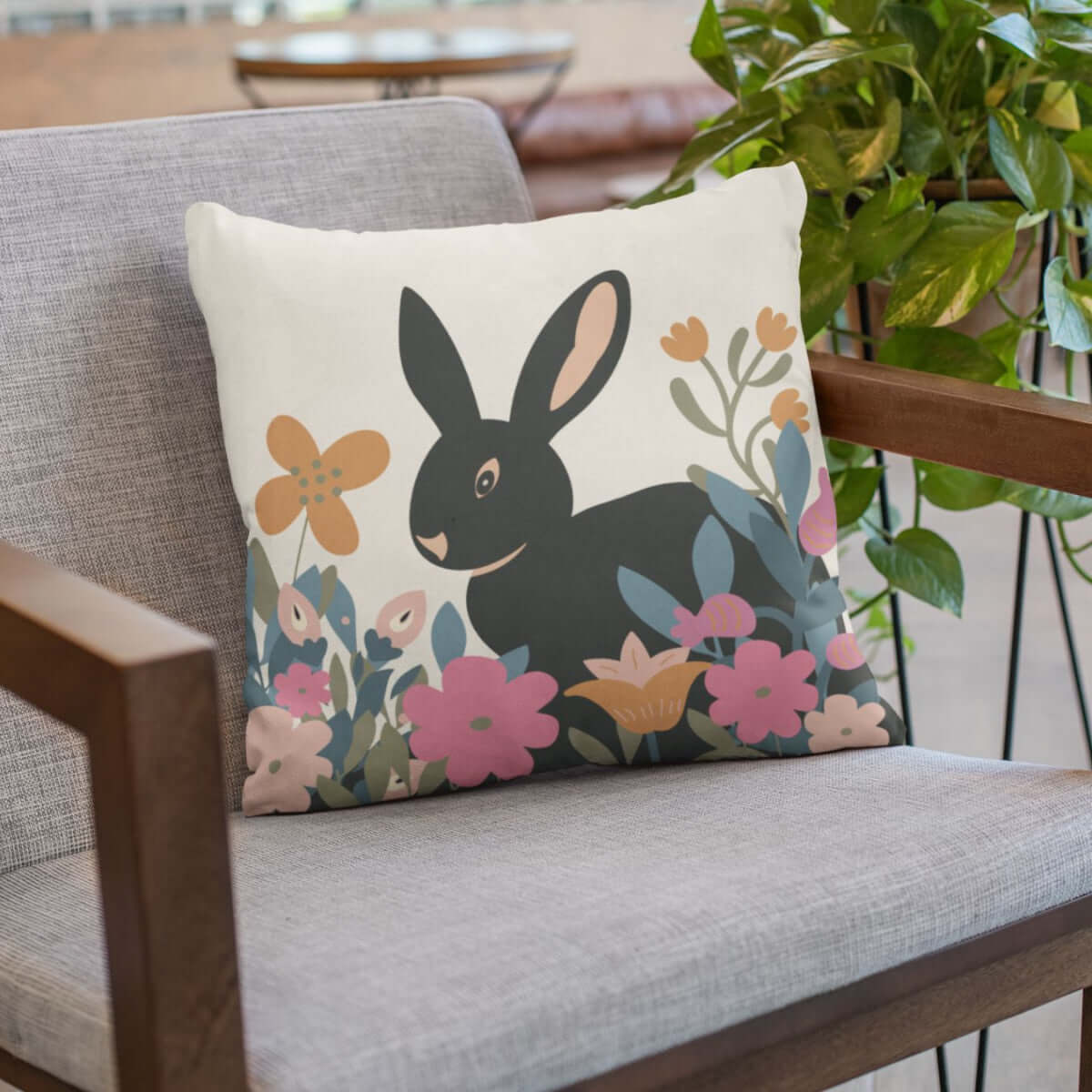 The floral garden bunny cozy comfy throw pillow in chair with house plant