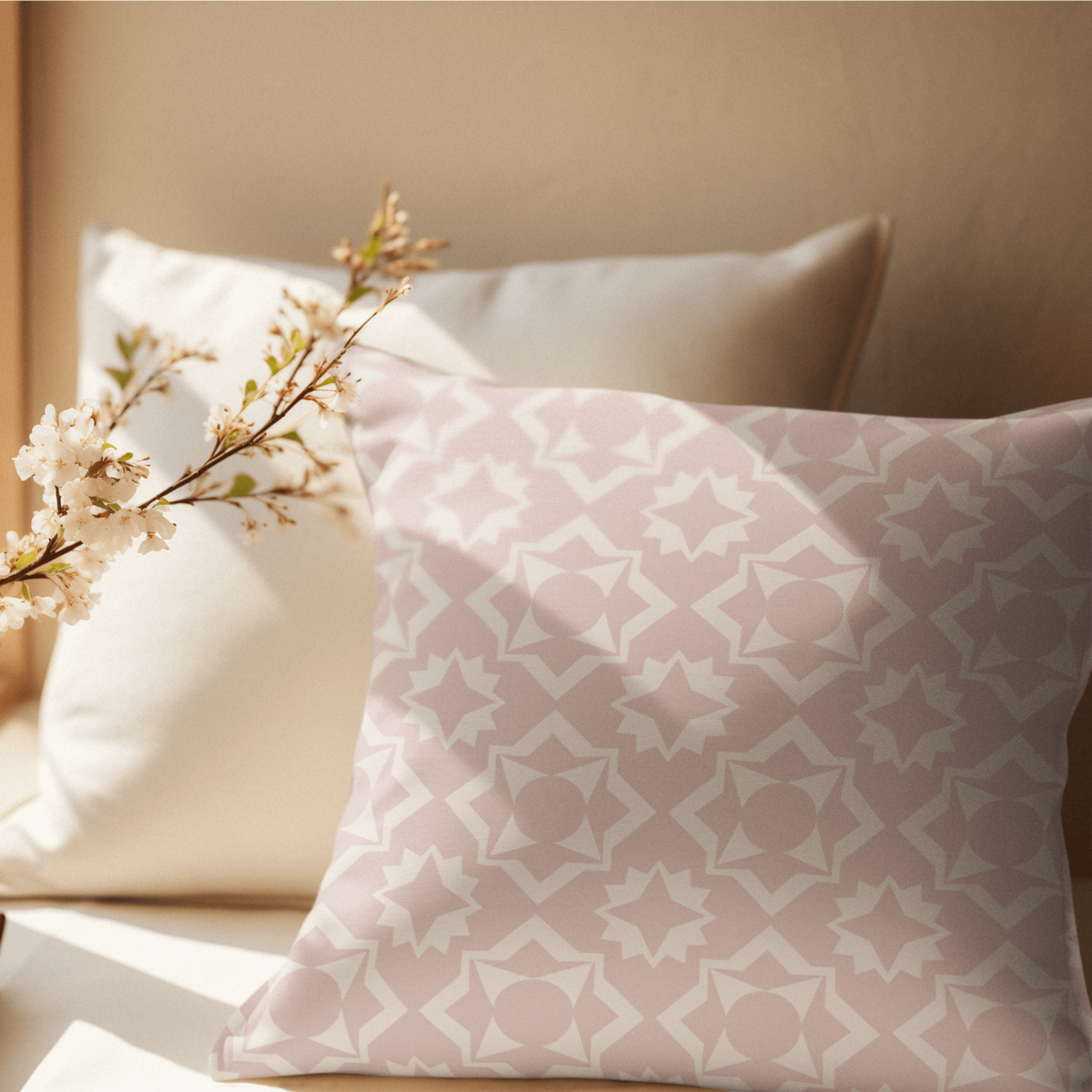The Branch pillow is an inviting soft and cozy linen polyester pillow in a soft pink and beige vintage pattern. 