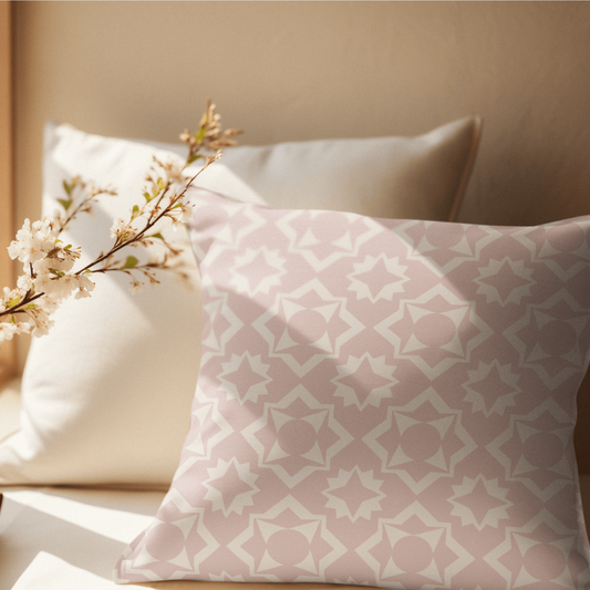 The Branch pillow is an inviting soft and cozy linen polyester pillow in a soft pink and beige vintage pattern. 