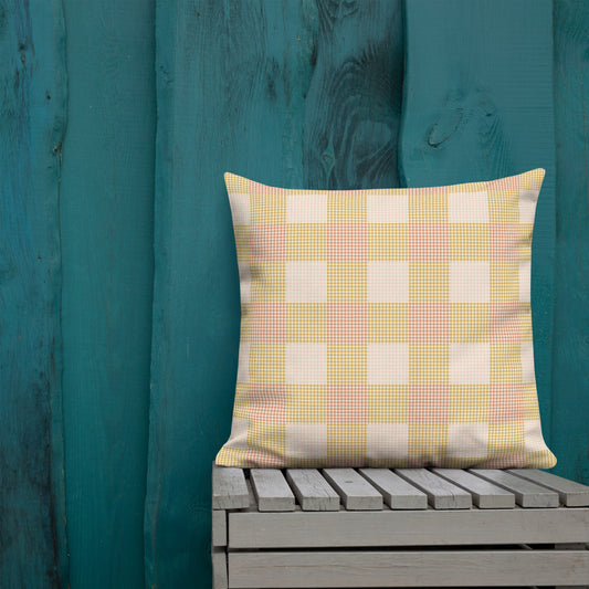 The Clara throw pillow is a colorful mix of plaid and houndstooth in a pastel color palette that is perfect for adding a soft warmth to bright or cool color schemes.