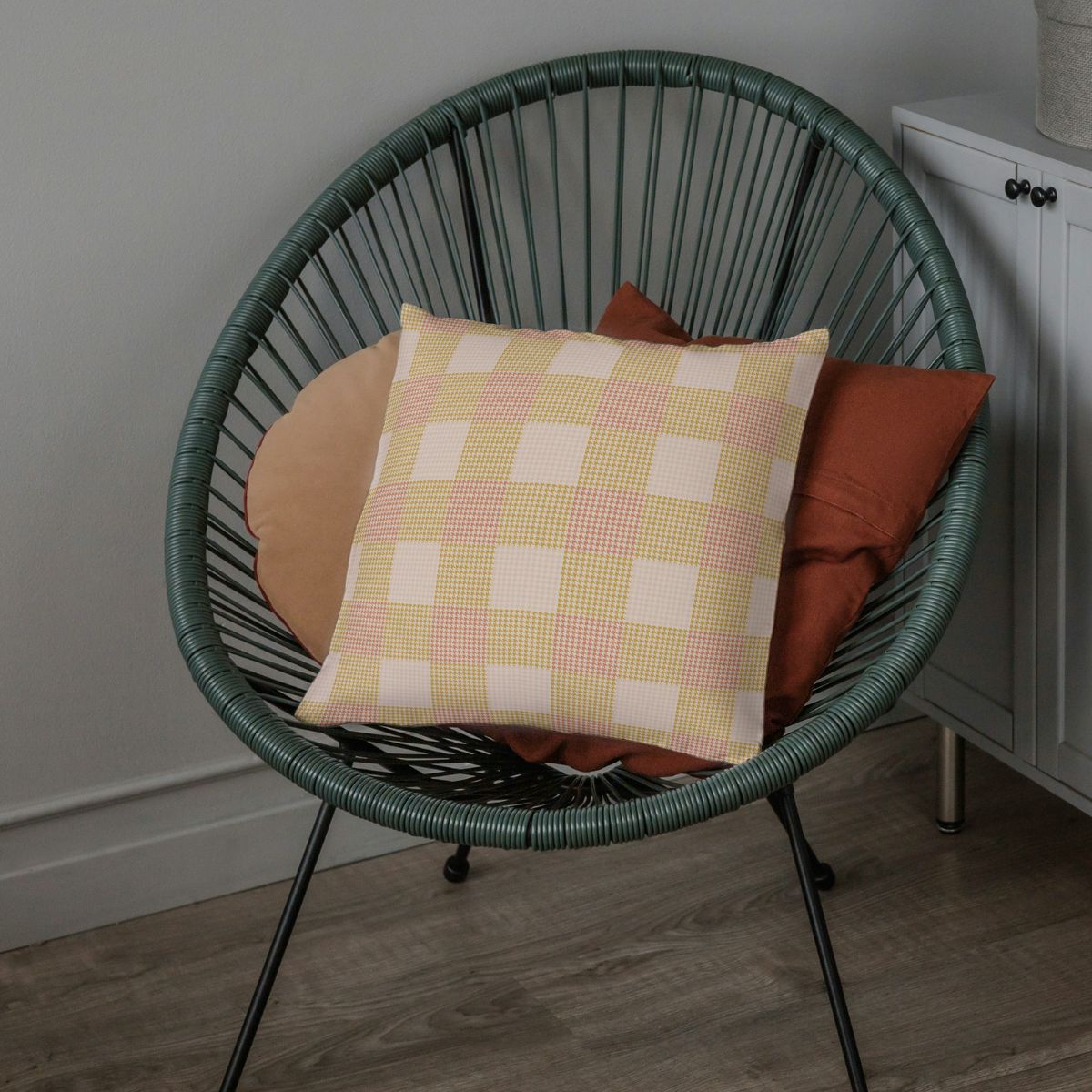 The Clara pillow adds a colorful cheerfulness to an otherwise gray color scheme.