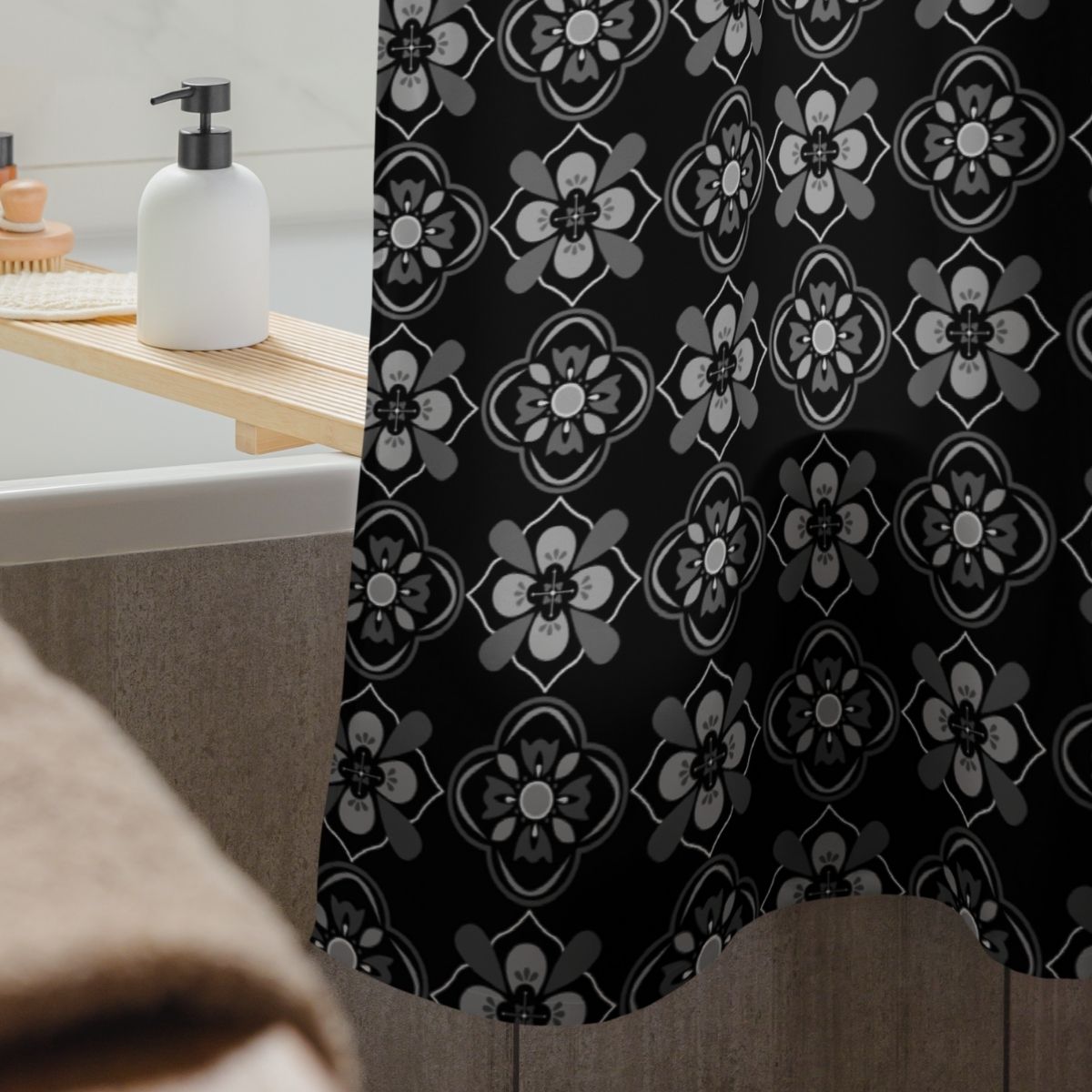 Fabric shower curtain with a black and white floral pattern in a bathroom setting