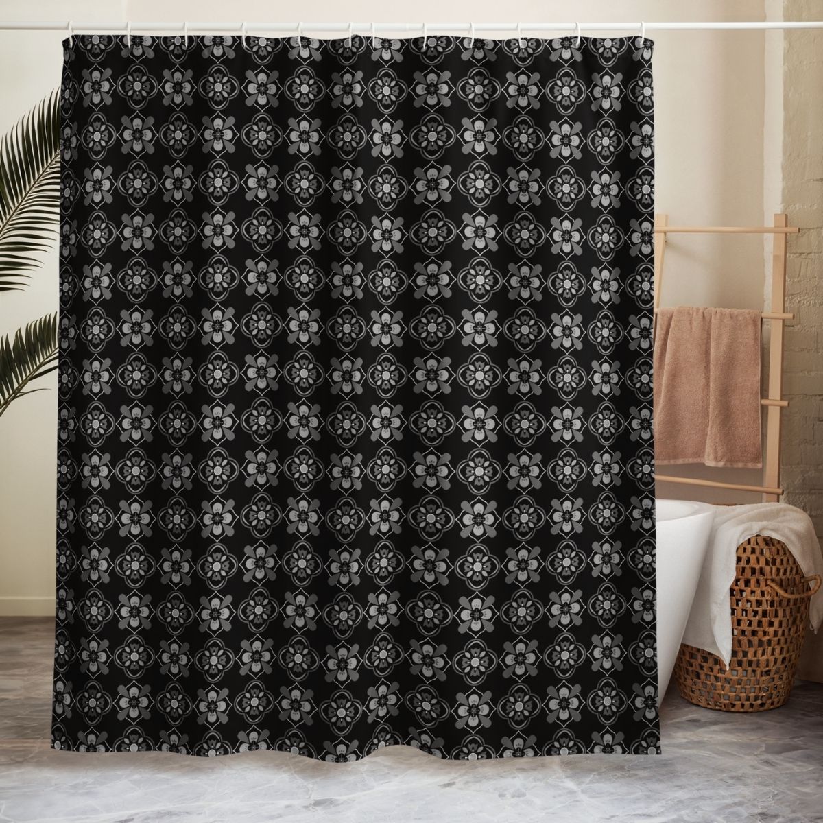Black and white floral patterned fabric shower curtain in a bathroom setting.