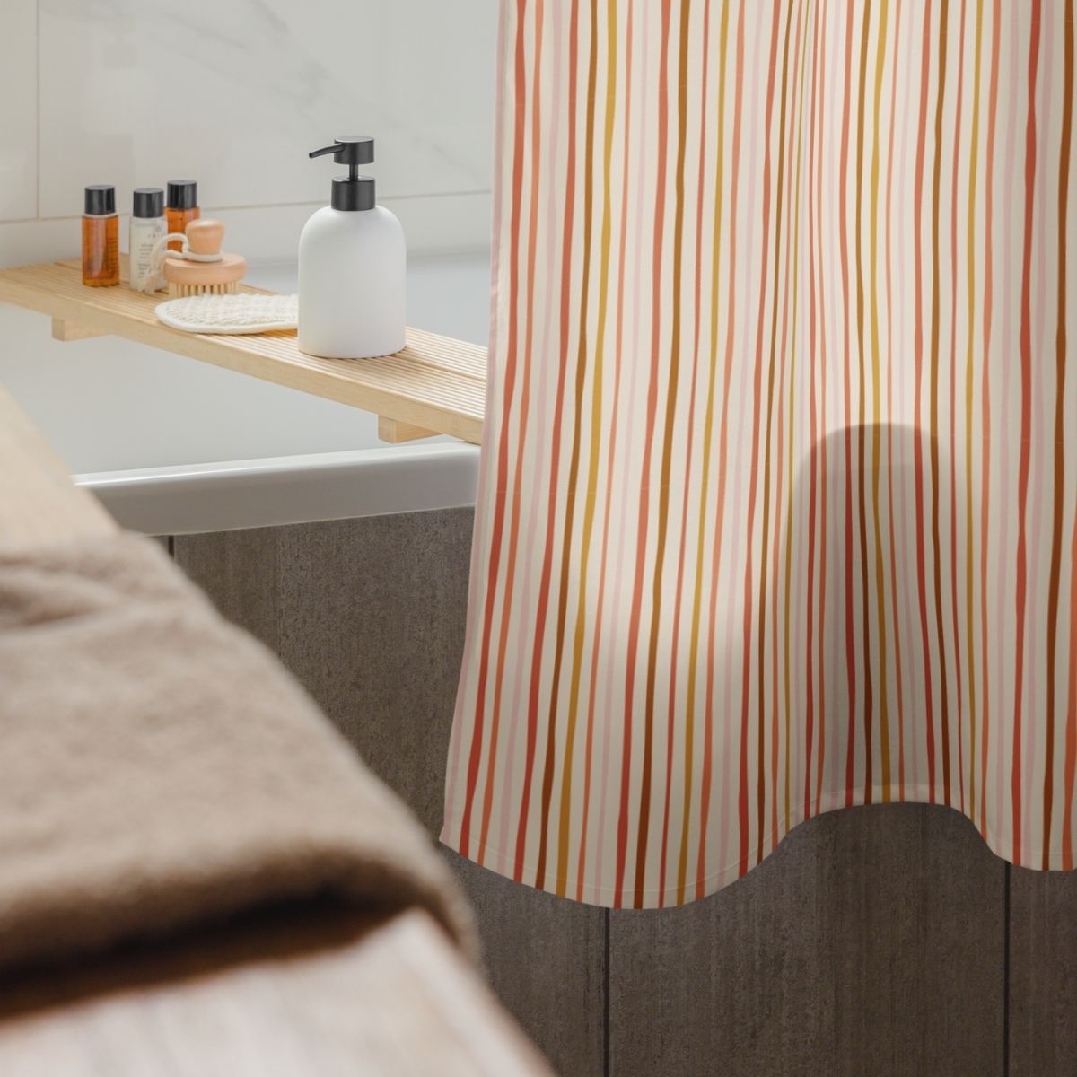 Bathroom with striped shower curtain, sink, and toiletries.