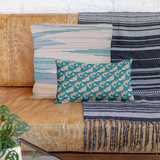 The Oliver lumbar throw pillow for couch is shown with the Delja sunset throw pillow.