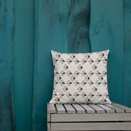 This decorative throw pillow in bone white and brown adds rustic charm to any covered patio