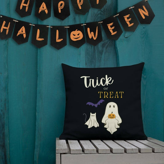 Halloween-themed pillow with 'Trick or Treat' text and graphics on a teal background with 'Happy Halloween' banner.