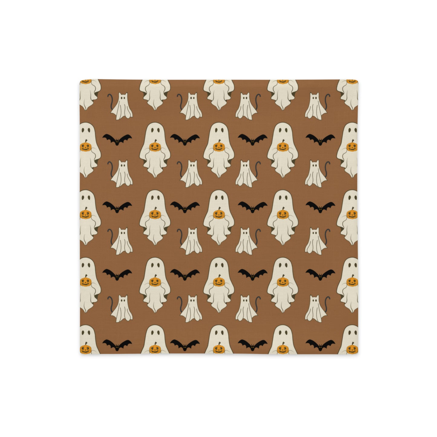 Halloween pillow cover with ghosts, cats, bats, and pumpkins against a brown background.
