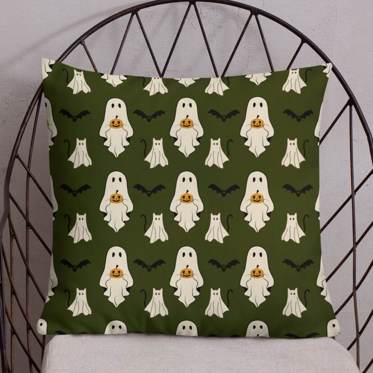 Decorative pillow with Halloween ghost pattern on a chair
