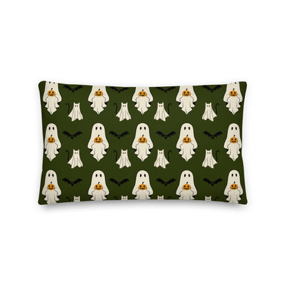 Pillow with Halloween ghost pattern on a green background