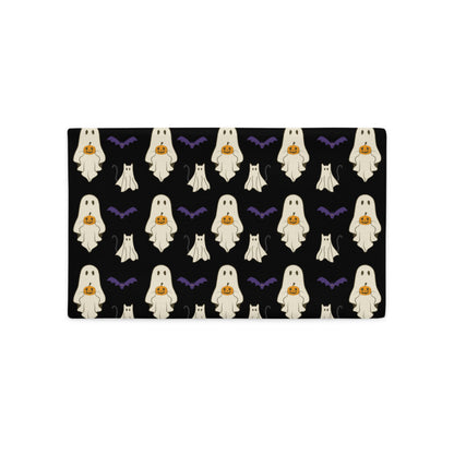 Halloween-themed lumbar pillow cover with ghosts, pumpkins, and bats on a black background