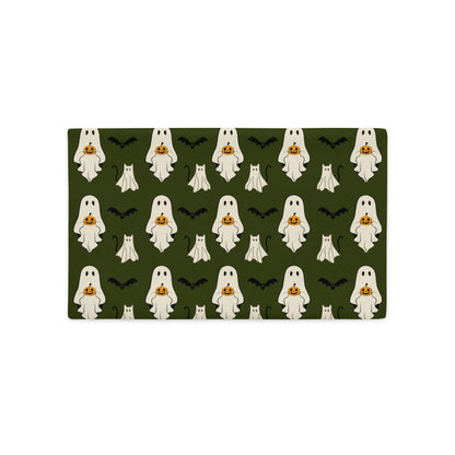 Halloween-themed lumbar pillow cover with ghosts and pumpkins on a green background