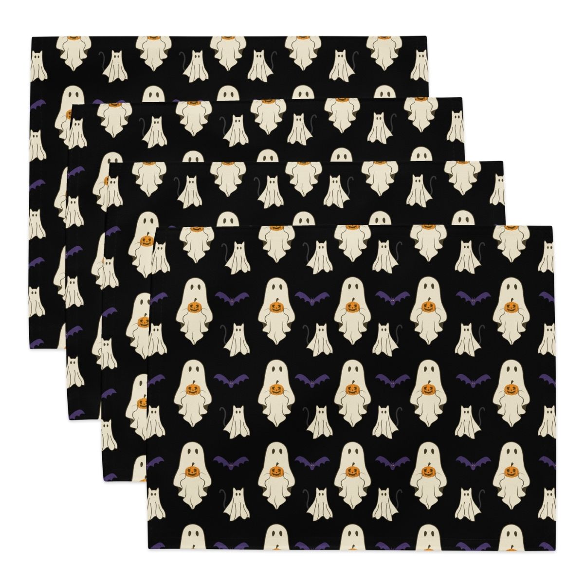 Set of Halloween-themed placemats with ghost and pumpkin pattern on black background