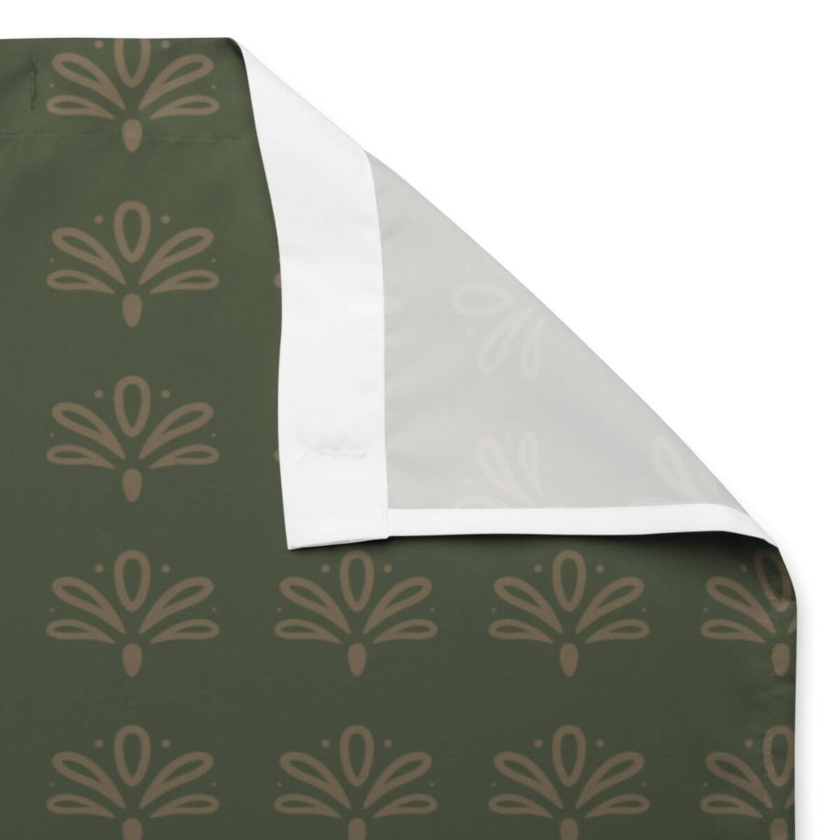 Green fabric with beige floral pattern, with sewn eyelets for shower curtain rings on a white background
