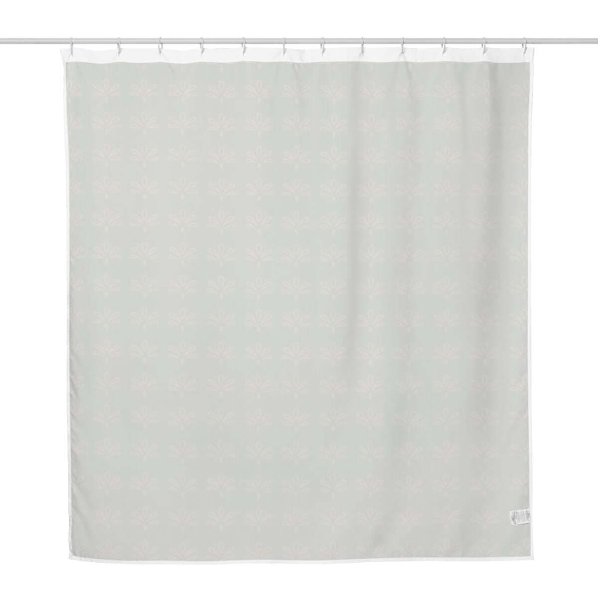 Vintage mossy green floral fabric shower curtain with white back side against a white back drop