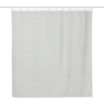Vintage mossy green floral fabric shower curtain with white back side against a white back drop