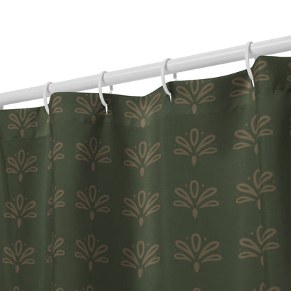 Green shower curtain with a floral pattern on a white rod