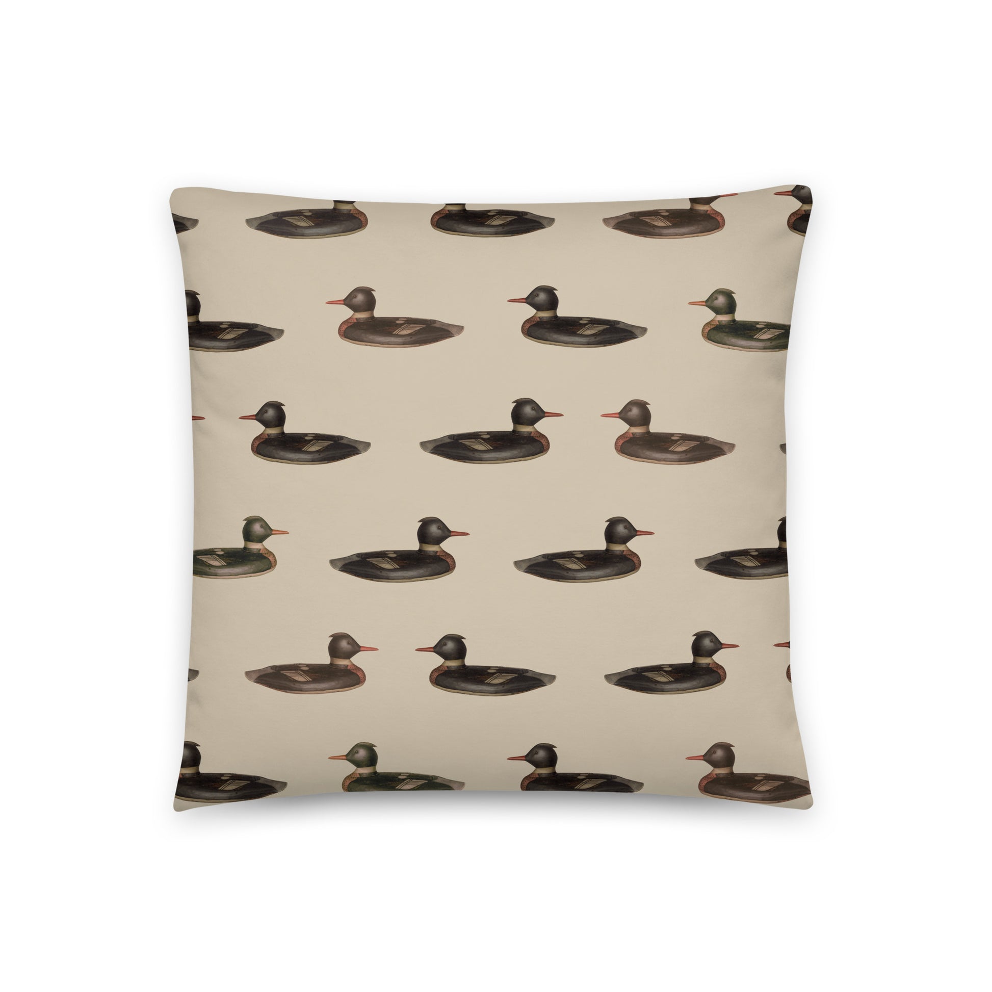 The front side of this pillow features a duck pattern, and the back showcases a classic plaid pattern. 