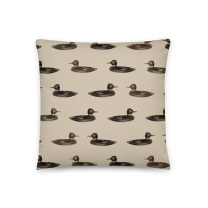 The front side of this pillow features a duck pattern, and the back showcases a classic plaid pattern. 