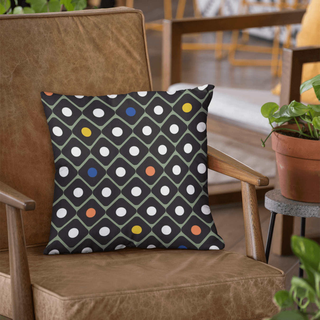 The Brooke retro decorative throw pillow is right at home in this mid-century leather chair. This pillow features bright colors of the pop art movement.