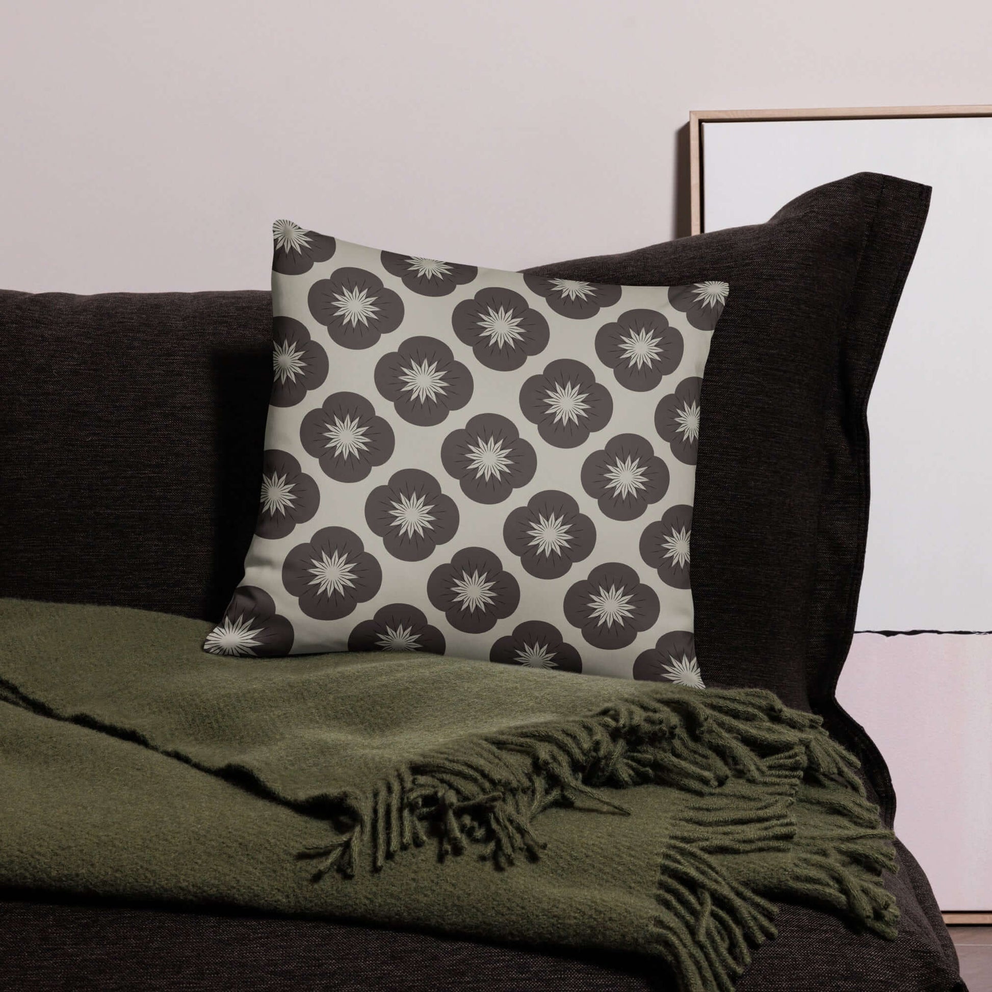 This satin-polyester pillow adds a cozy vintage charm to any room with its soft fabric and floral pattern in neutral colors.