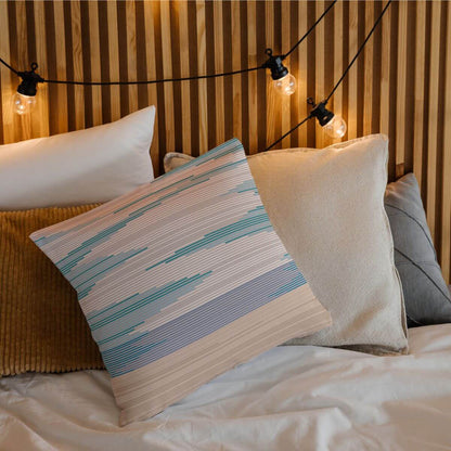 Add beachy vibes to your home decor with the Delja throw pillow featuring a modern sunset view from the beach.