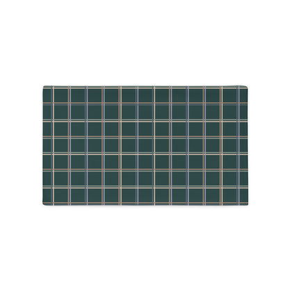 The Glen lumbar throw pillow adds charm and personality to any home decor style with its soft pastel plaid design.