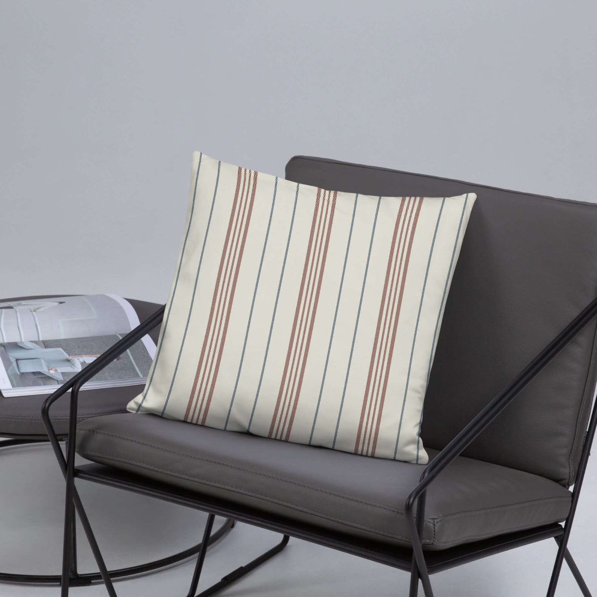 The meadow striped pillow in a modern gray chair