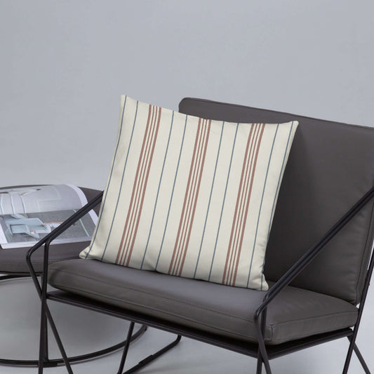 The meadow striped pillow in a modern gray chair