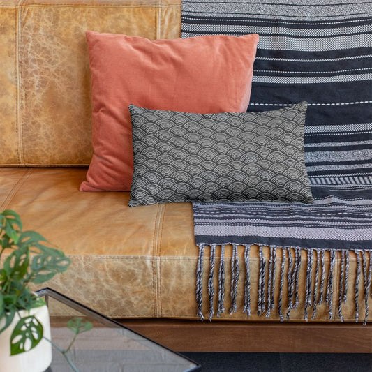 The Alon decorative throw pillows for leather couch adds a fun pattern to any living room