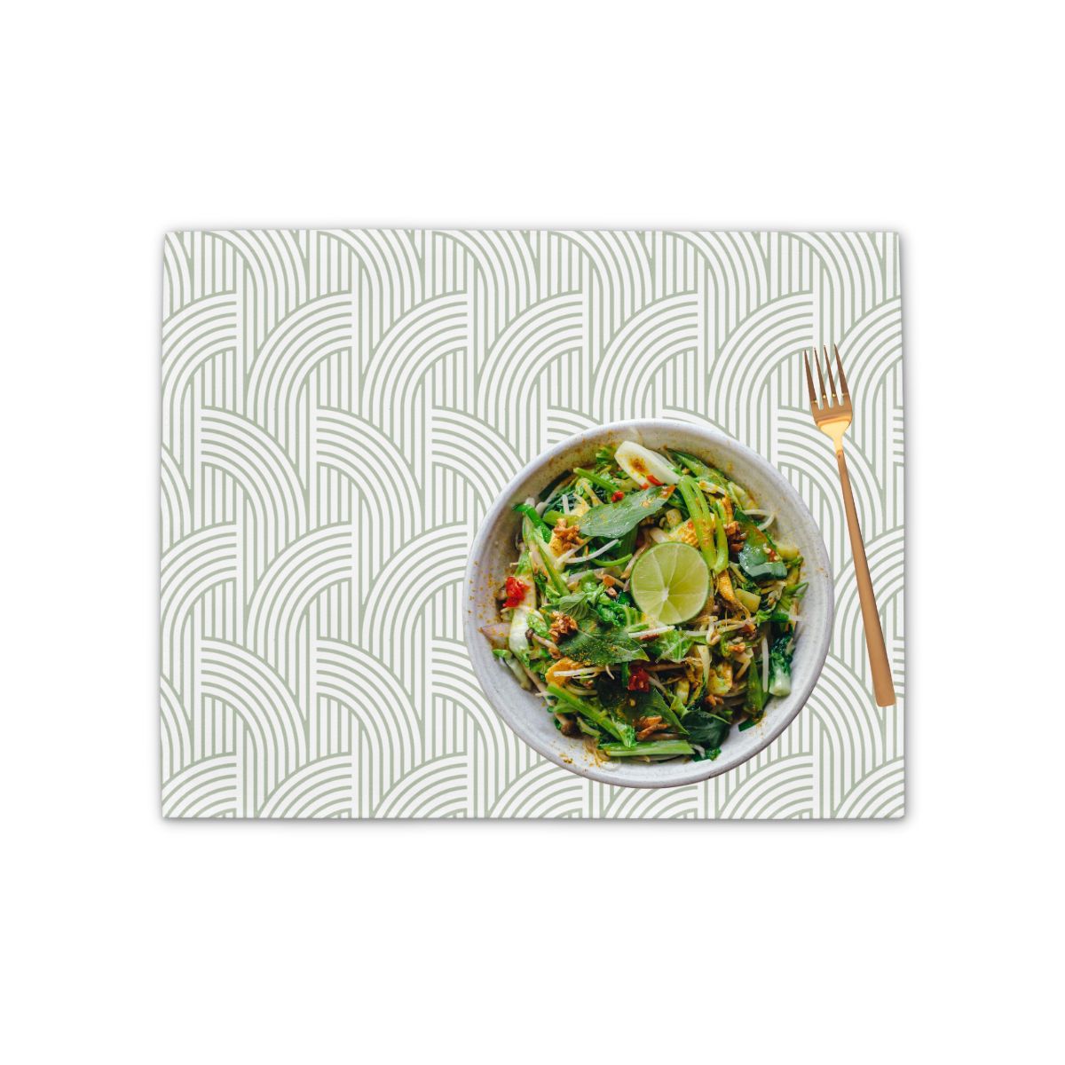 Placemat with a bowl of salad and fork on a white background