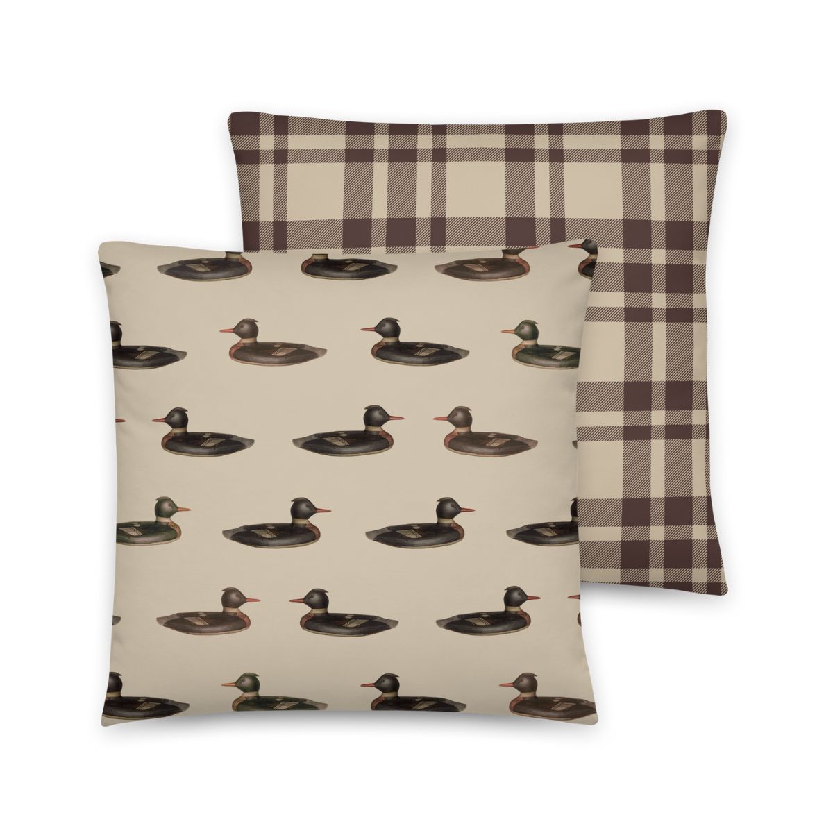 Two pillows, one with duck pattern and one with plaid design, on a white background.