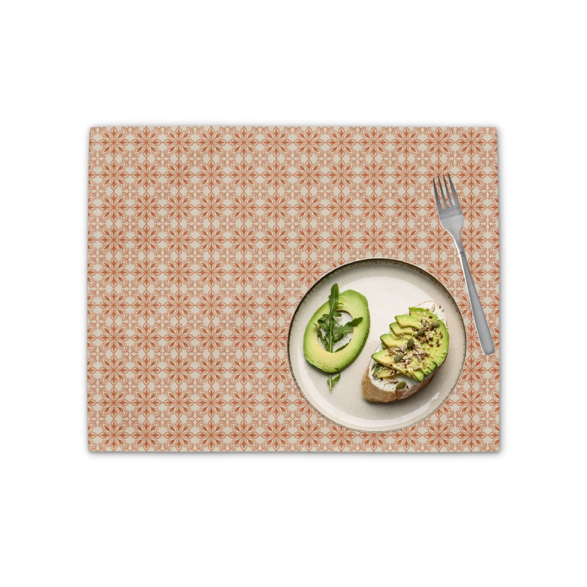 Placemat with a plate of avocado toast and a fork on a white background