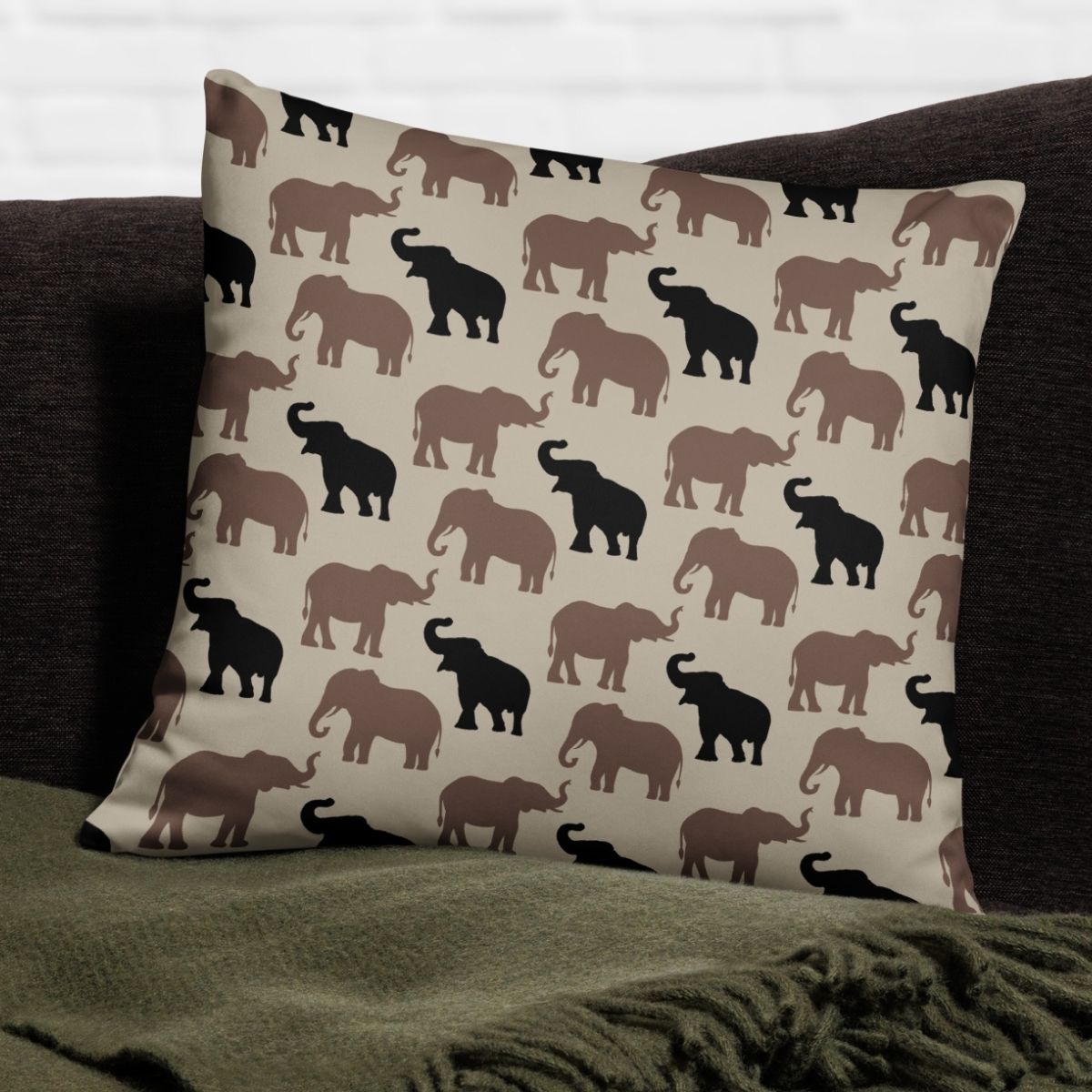 Pillow with elephant pattern on a couch creating a cozy yet modern vibe.